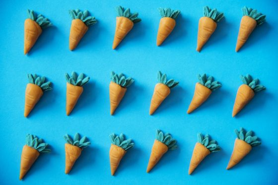 Why big businesses are copying smaller ones. Image shows three rows of identical carrot models
