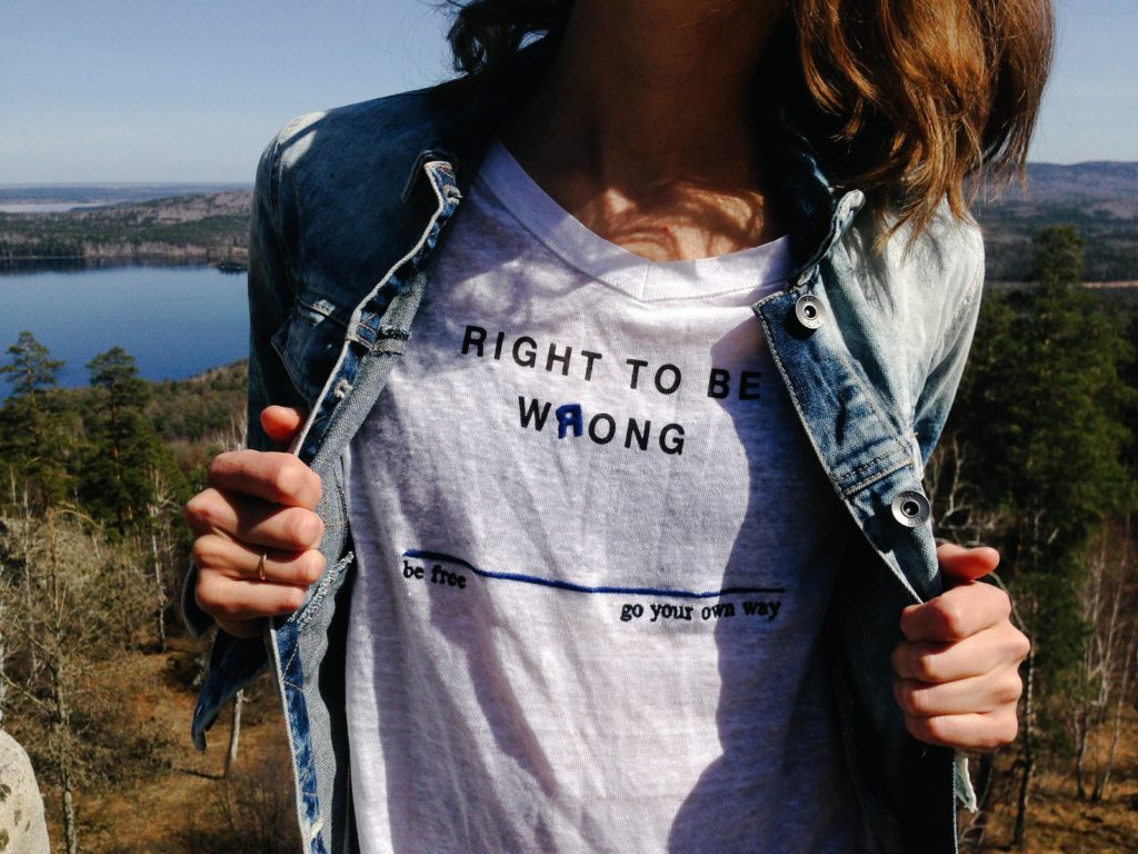 The right to hold different points of view. Image shows a woman wearing a tshirt that says "the right to be wrong"