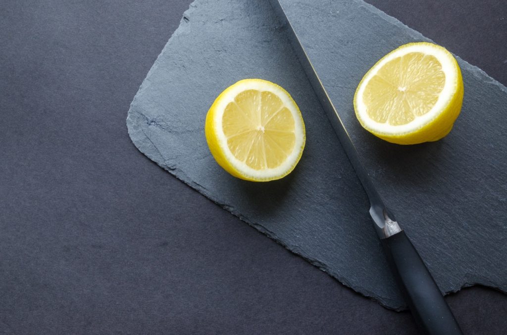 Half of what you publish is useless. Image shows a lemon cut in half on a slate background
