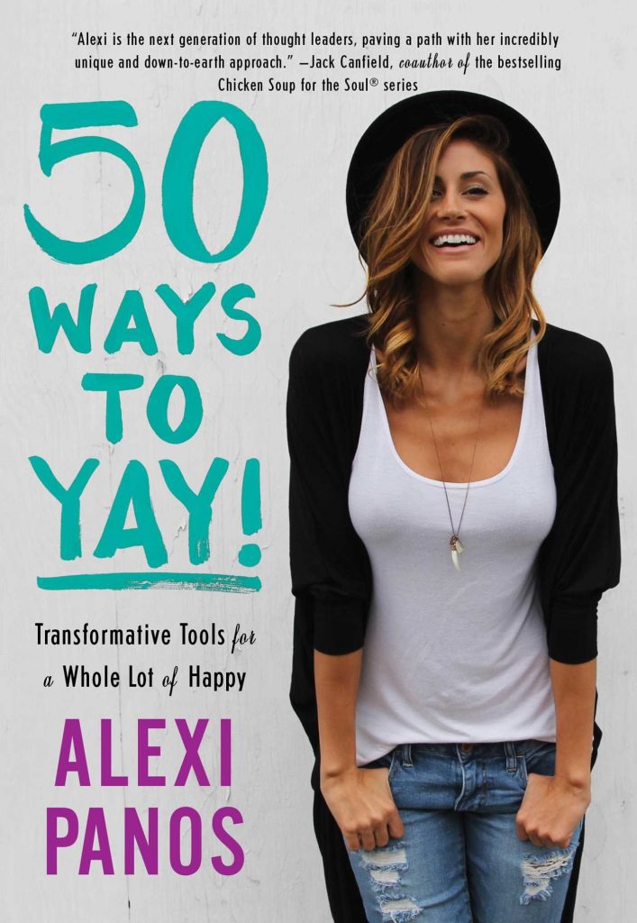 Image shows a women in a black hat, white vest and black jacket. Cover of the book 50 Ways to Yay!