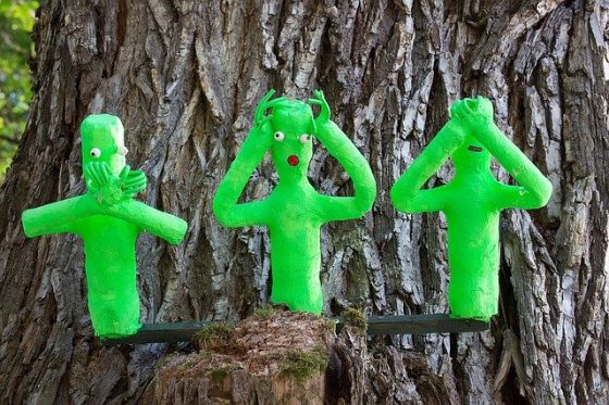 Image shows three green figures doing say no evil, hear no evil, see no evil. Make like there is no football